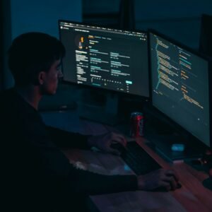 man in black long sleeve shirt using computer